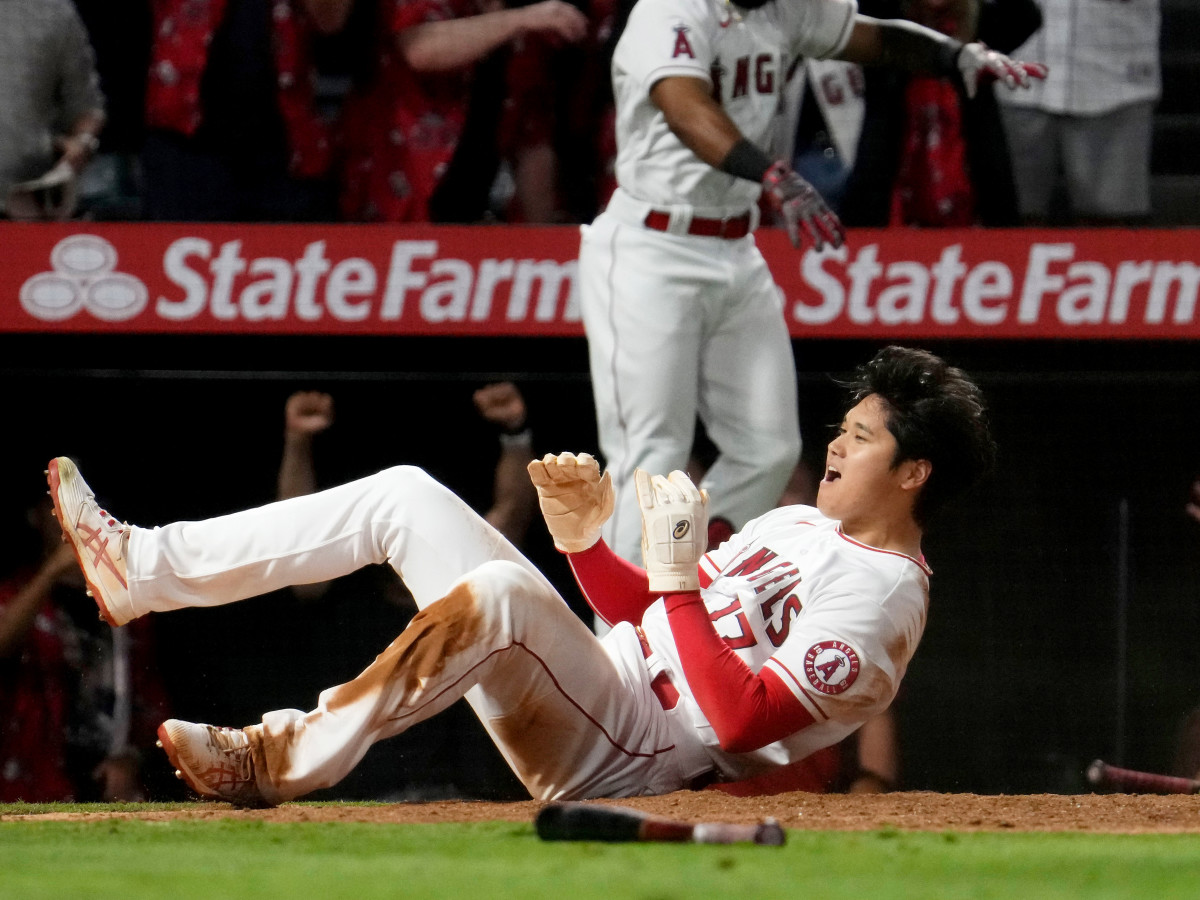 Shohei Ohtani reacts after sliding in safely at home and scoring the winning run in the ninth inning as the Angels defeated the Orioles, 8–7, at Angel Stadium on July 2.